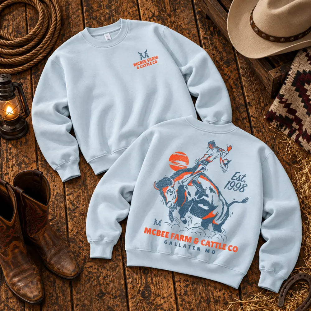 Guy on a Buffalo Crewneck McBee Farm & Cattle Co